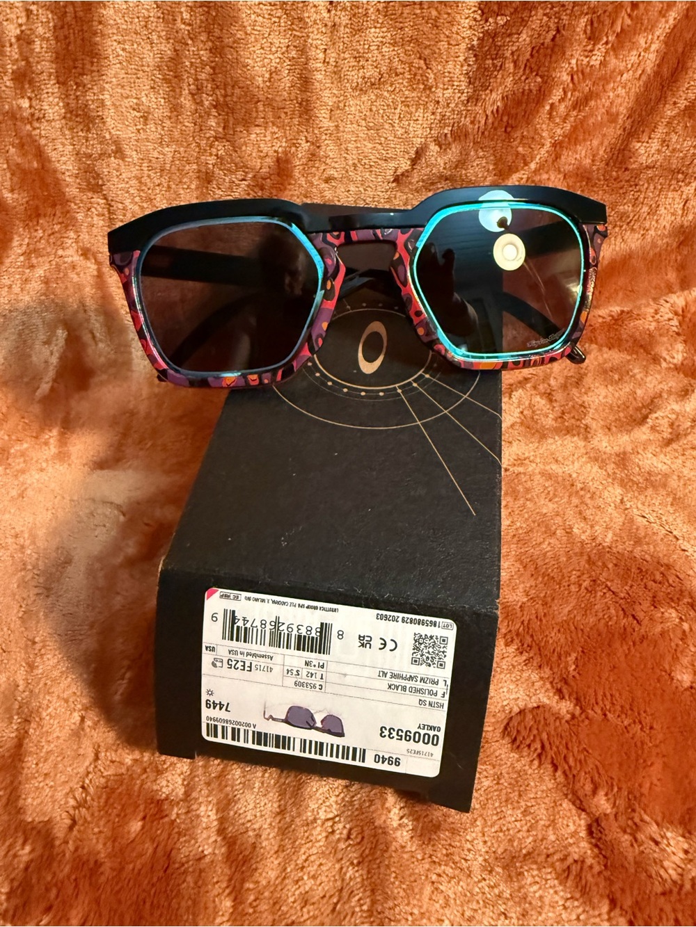 Oakley men’s Black Frame Sunglasses with Pink & Teal Accents